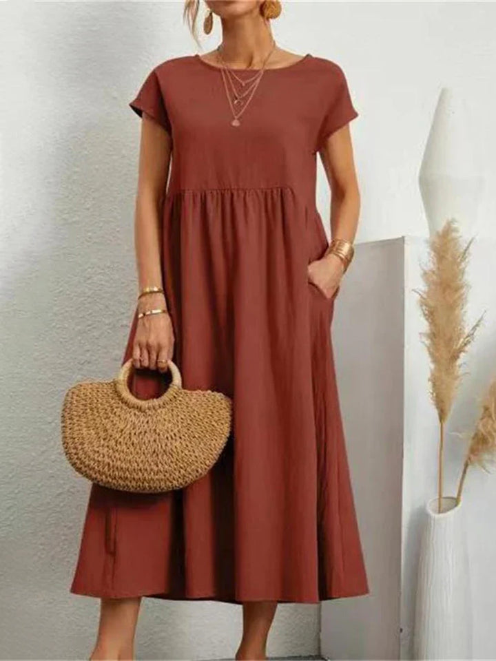 Elegant damekjole i vintage stil med O-hals, myk bomull, flatterende passform.