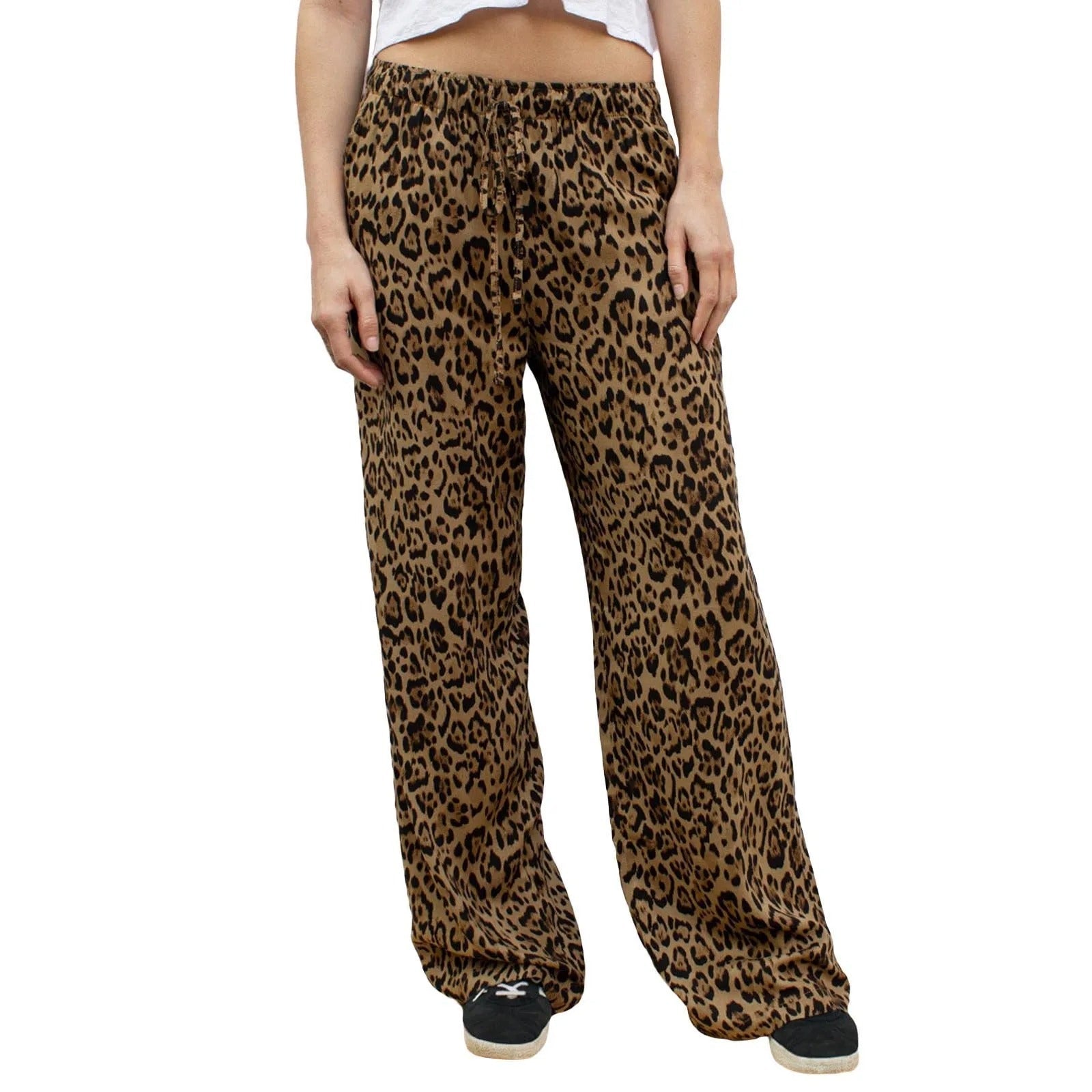 Trendy leopardprint bukser for kvinner, vide ben, vintage design. Perfekt for en stilig hverdagslook.