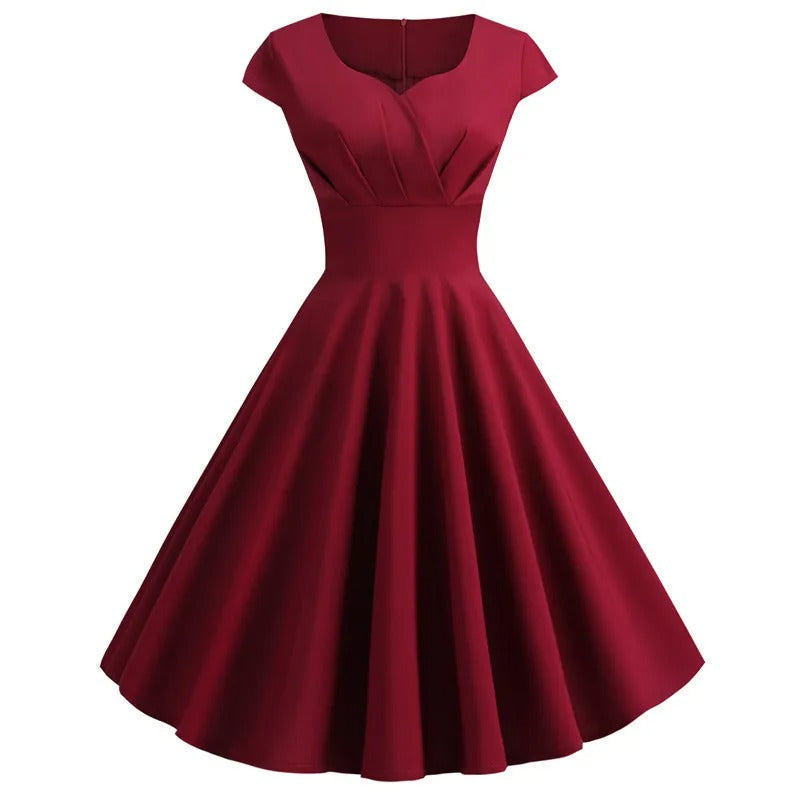 Moderne retro midi-kjole for kvinner med feminin V-hals. Perfekt som sommerkjole, festkjole eller elegant hverdagskjole.