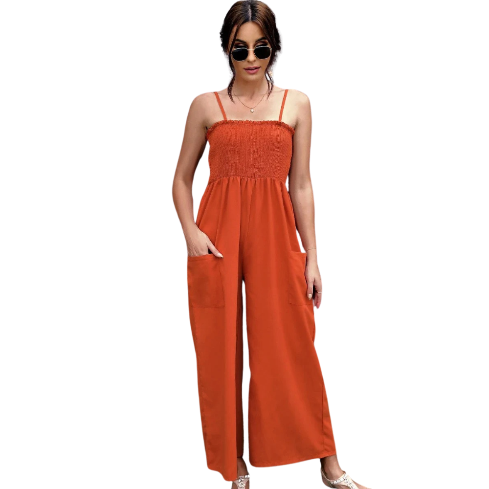 Vintage sommerromper for dame med tynne spagettistropper, vide ben og praktiske lommer. Komfortabel sommerstil.