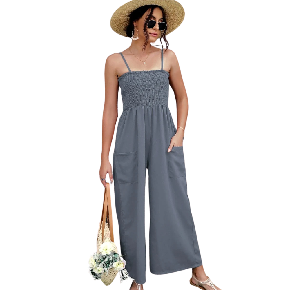 Komfortabel dame romper i vintage stil med praktiske sidelommer og elastisk midje. Ideell for ferie og casual bruk.
